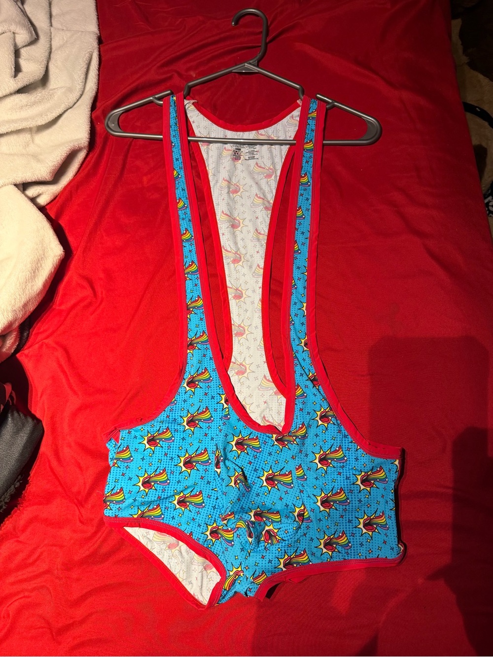 Andrew Christian Blue One-Piece with Red Trim and Starburst Print